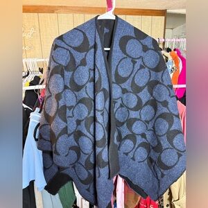 Coach Reversible Signature Poncho
black/blue & midnight/navy. One size fits all